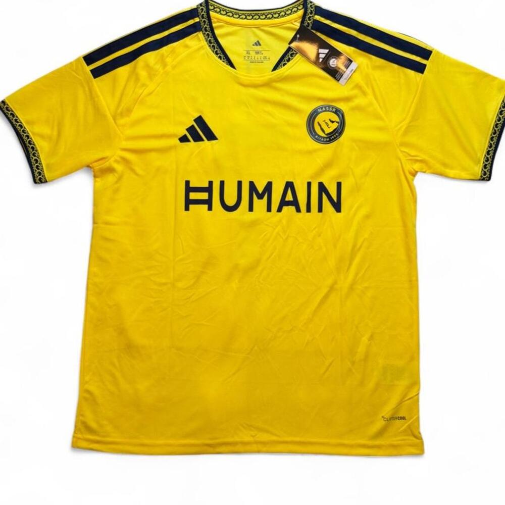 Adidas Al Nassr 2026/27 home jersey in yellow with black stripes on shoulders an